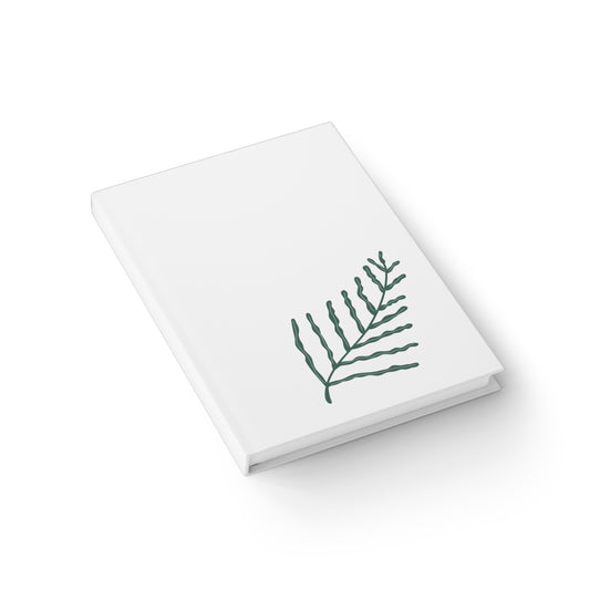 Cuaderno de notas con líneas rayadas y diseño de helechos